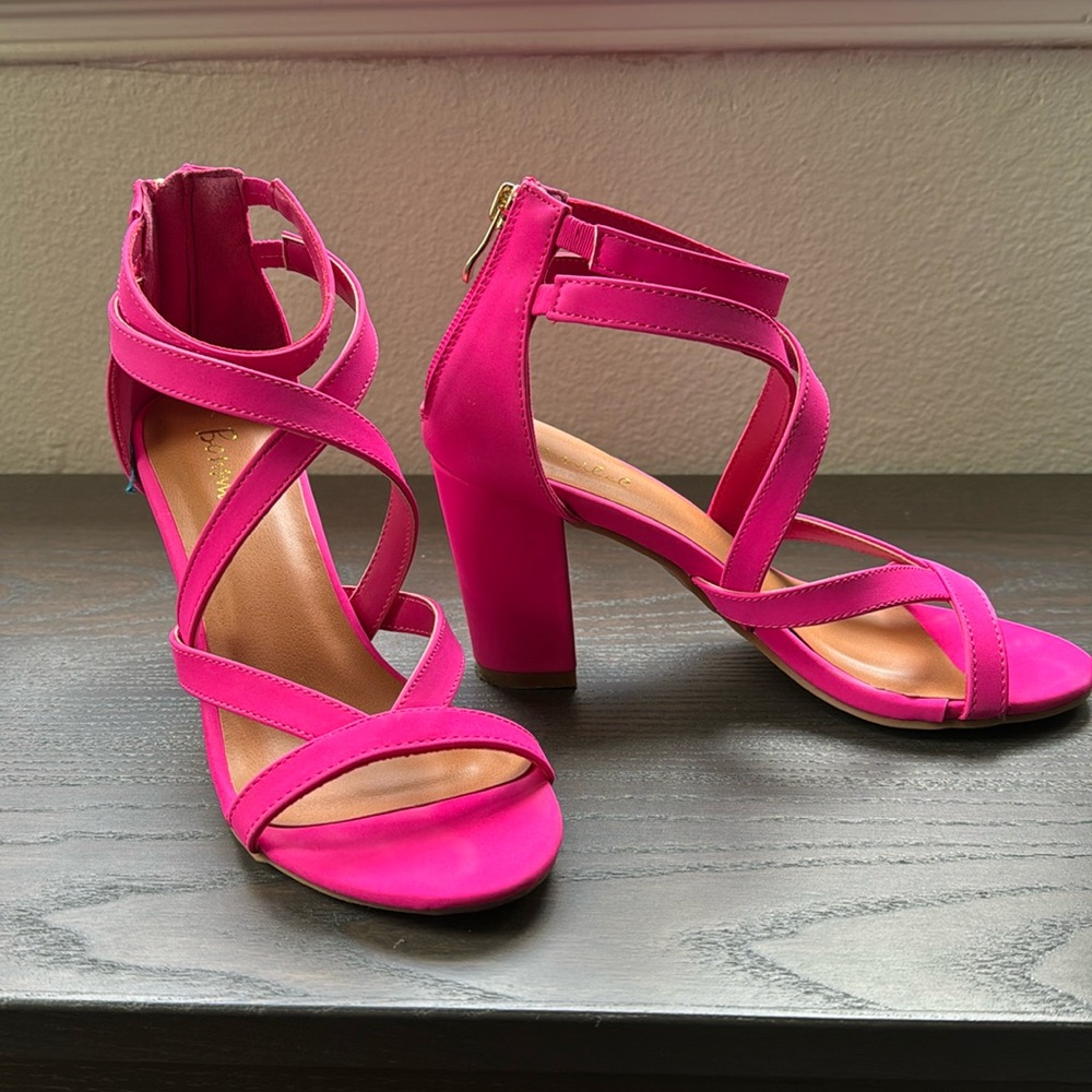 Hot pink strappy heels.